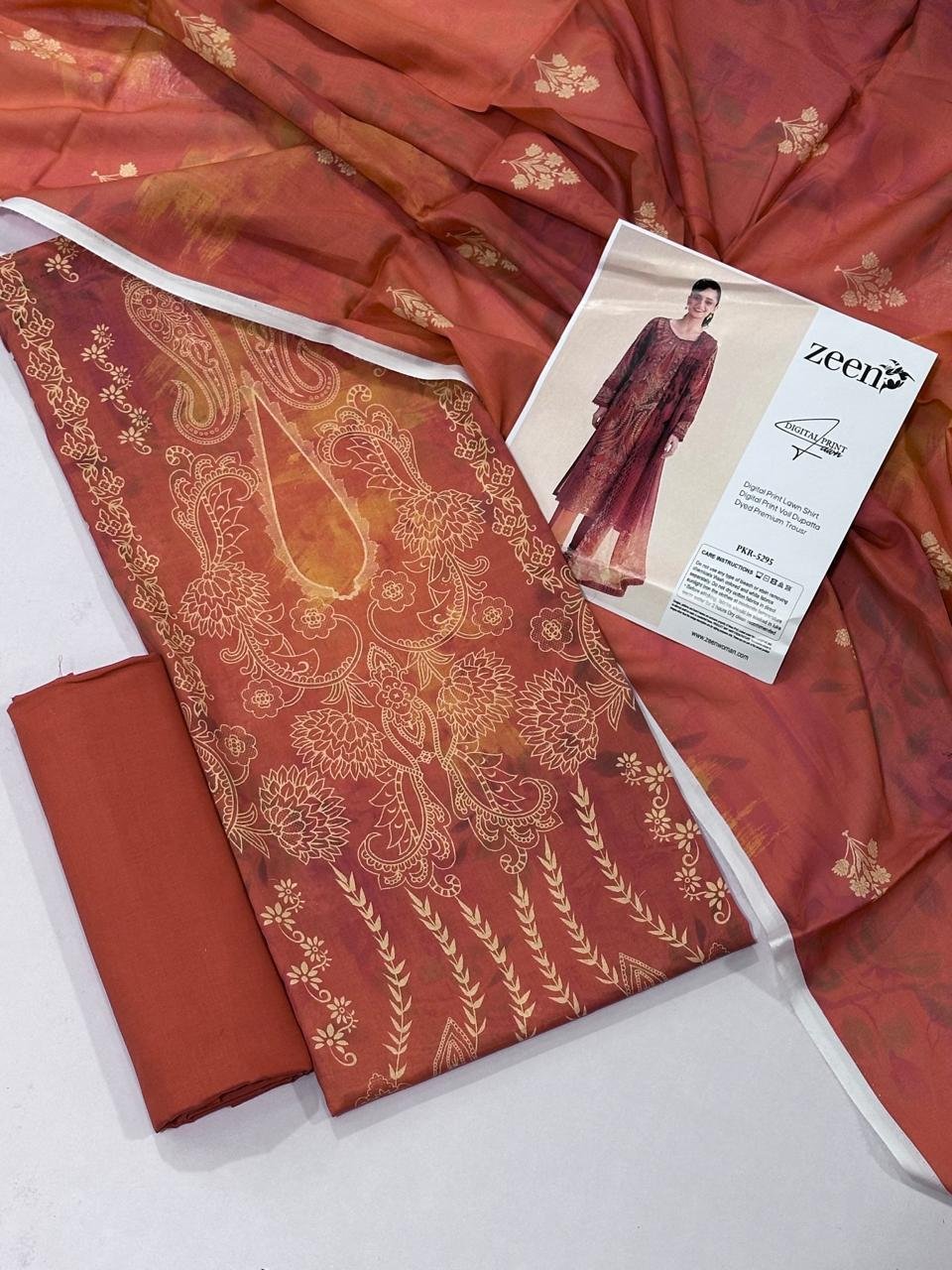 Zeen Lawn Unstitched 3 Piece Suit | Colour-Brownish Red Zeen Lawn Unstitched 3 Piece Suit | Colour-Brownish Red