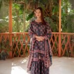 Women wear Iznik Lawn Unstitched 3 Piece Suit in Dark Gray Blue