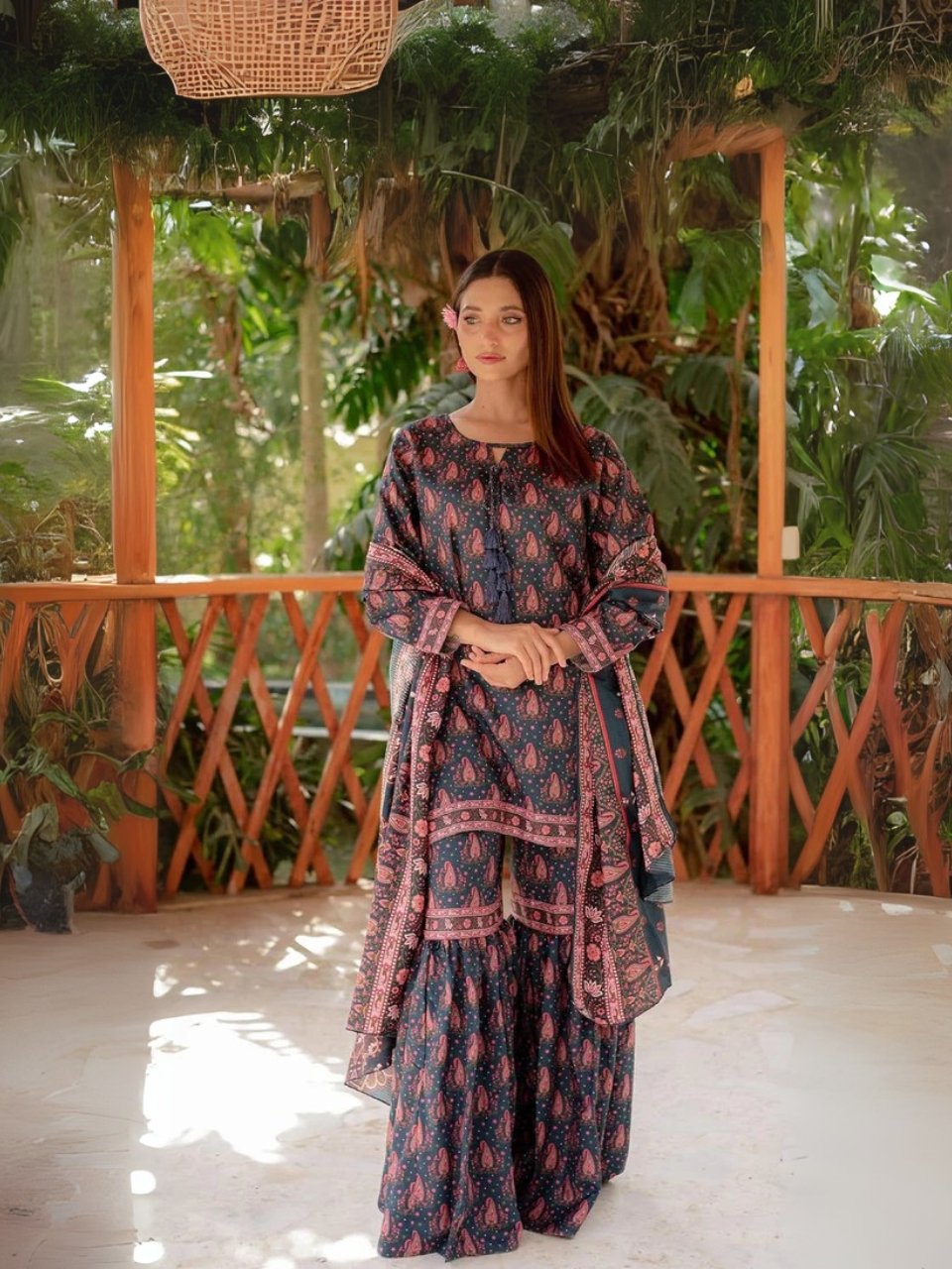 Women wear Iznik Lawn Unstitched 3 Piece Suit in Dark Gray Blue