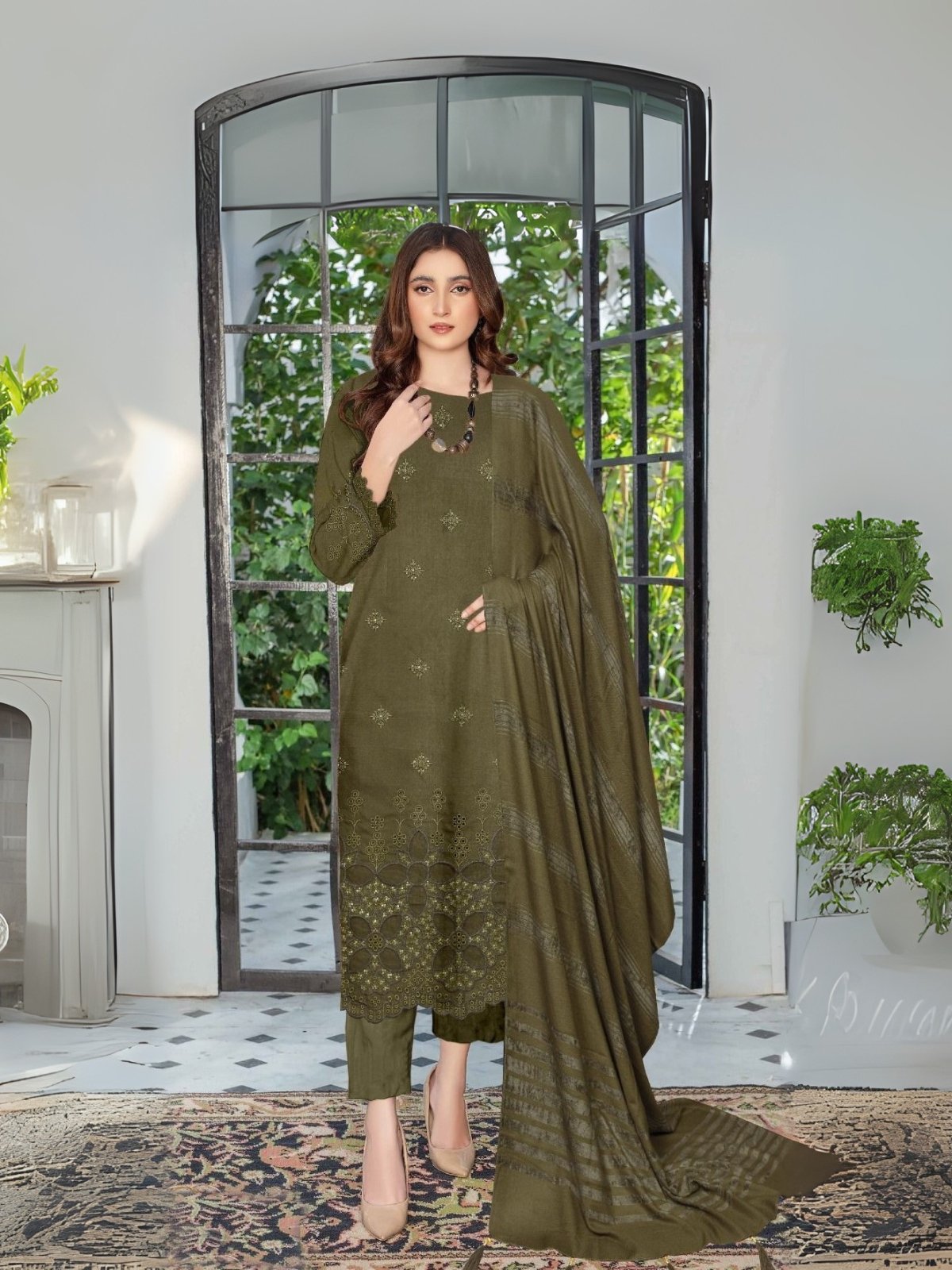 Women wear Bint-e-Naz Embroidered Suit in Tombaco Green