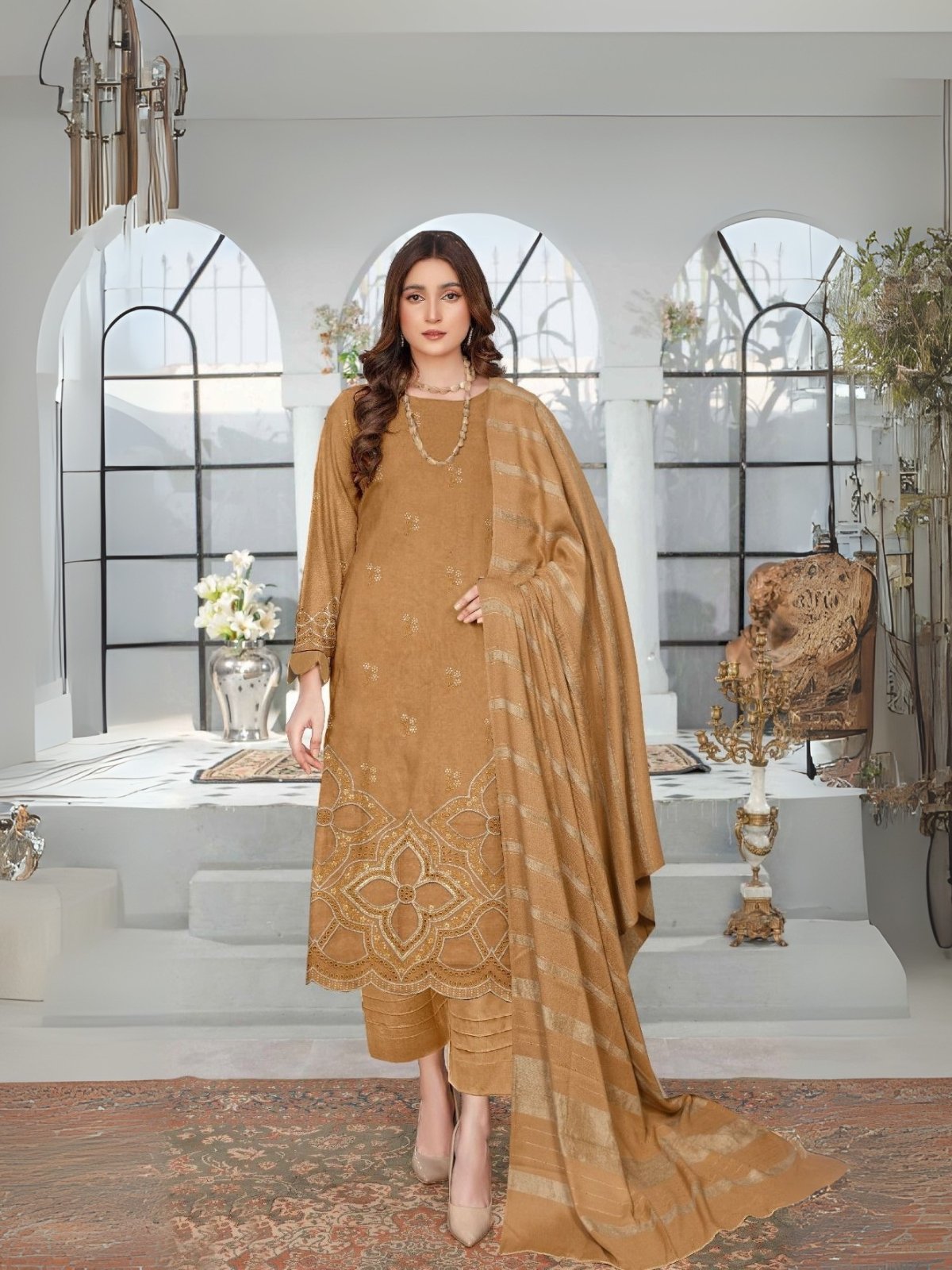Women wear Bint-e-Naz Embroidered Suit in Dull Brown