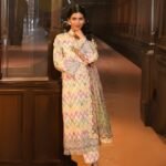 model wearing Pinkish Grey suit