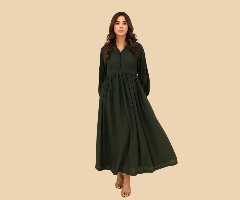 Woman in a dark green long-sleeve Western dress with gold sandals on a beige background.